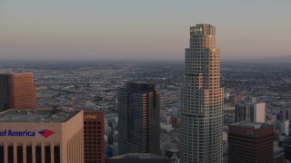 HDA06_54 - HD stock footage aerial video flyby US Bank Tower to reveal Bank of America Center at sunset, Downtown Los Angeles, California