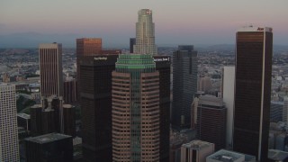 HDA06_61 - HD stock footage aerial video fly over Figueroa at Wilshire to approach US Bank Tower at twilight, Downtown Los Angeles, California
