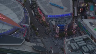 HDA06_65 - HD stock footage aerial video bird's eye view of Staples Center and Nokia Theater at twilight in Downtown Los Angeles, California