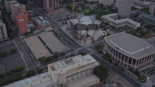 HDA06_70 - HD stock footage aerial video orbit Walt Disney Concert Hall and Dorothy Chandler Pavilion at twilight in Downtown Los Angeles, California
