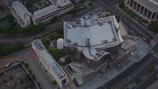 HDA06_71 - HD stock footage aerial video an orbit of the Walt Disney Concert Hall at twilight in Downtown Los Angeles, California