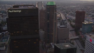 HDA06_76 - HD stock footage aerial video flyby Downtown Los Angeles skyscrapers at twilight to reveal Staples Center and Ritz-Carlton in California