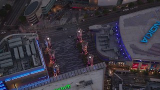 HDA06_78 - HD stock footage aerial video tilt to bird's eye view of Nokia Theater and Staples Center at twilight, Downtown Los Angeles, California