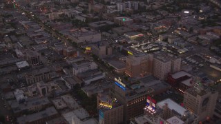 HDA06_82 - HD stock footage aerial video fly over office buildings and W Hotel near Capitol Records to follow Hollywood Boulevard at twilight, Hollywood, California