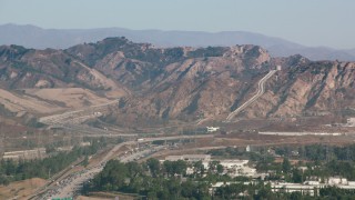 HDA07_05 - HD stock footage aerial video of the Los Angeles Aqueduct and mountains in San Fernando Valley, California