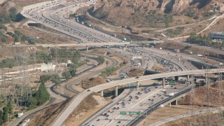 HDA07_07 - HD stock footage aerial video following I-5 with heavy traffic, San Fernando Valley, California