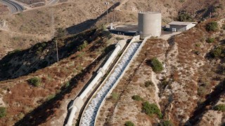 HDA07_10 - HD stock footage aerial video of the top of the Los Angeles Aqueduct, San Fernando Valley, California