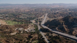 HDA07_15 - HD stock footage aerial video of following Highway 14 in Newhall, California