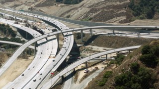 HDA07_30 - HD stock footage aerial video approach Newhall Pass interchange, Santa Clarita, California