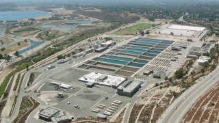 HDA07_33 - HD aerial stock footage video of a water treatment plant in Granada Hills, California
