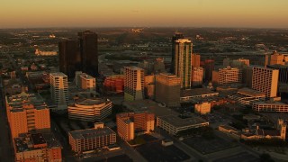 HDA12_002 - HD stock footage aerial video of flying by tall skyscrapers at sunset in Downtown Fort Worth, Texas