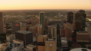 HDA12_009 - HD stock footage aerial video of passing tall high-rises buildings at sunset in Downtown Fort Worth, Texas