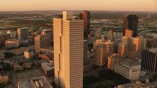 HDA12_010 - HD stock footage aerial video of Burnett Plaza and skyscrapers at sunset in Downtown Fort Worth, Texas