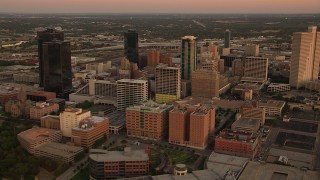 HDA12_014 - HD stock footage aerial video of a reverse view of skyscrapers at sunset in Downtown Fort Worth, Texas