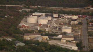 HDA12_015 - HD stock footage aerial video of industrial buildings and tanks at sunset in Fort Worth, Texas