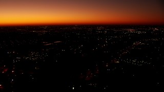 HDA12_018 - HD stock footage aerial video of a reverse view of neighborhoods at sunrise in Fort Worth, Texas