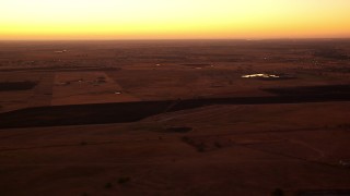 HDA12_025 - HD stock footage aerial video of farmland and homes at sunrise, Decatur, Texas