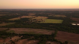 HDA12_031 - HD stock footage aerial video of a wide view of farmland at sunrise, Decatur, Texas