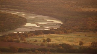 HDA12_053 - HD stock footage aerial video of farmland and oil rigs at sunrise by Red River, Texas