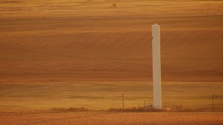 HDA12_059 - HD stock footage aerial video of a silo in the middle of a field at sunrise in Oklahoma