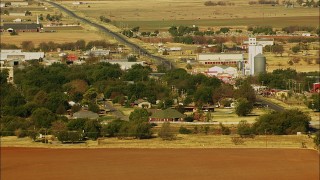 HDA12_081 - HD stock footage aerial video of a small town with a highway passing through it in Walters, Oklahoma