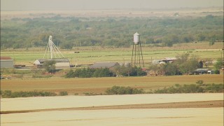 HDA12_089 - HD stock footage aerial video of a farm with a water tower in Walters, Oklahoma