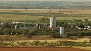 HDA12_101 - HD stock footage aerial video of silos and farmland, Temple, Oklahoma