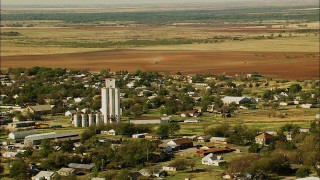 HDA12_103 - HD stock footage aerial video of flying over the town toward fields in Temple, Oklahoma