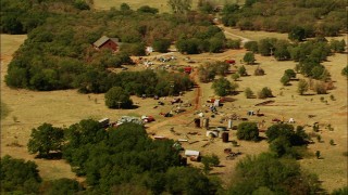 HDA12_106 - HD stock footage aerial video of rural home and junkyard in Temple, Oklahoma