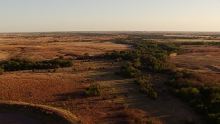 HDA12_133 - HD stock footage aerial video of trees, fields and countryside at sunset in Oklahoma