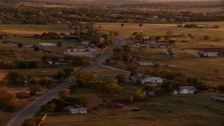 HDA12_149 - HD stock footage aerial video of a small rural town at sunset in Nocona, Texas