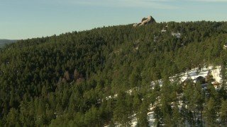 HDA13_286 - HD stock footage aerial video of flying over homes and forest in the Rocky Mountains, Colorado