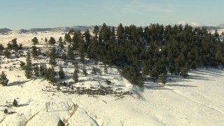 HDA13_316 - HD stock footage aerial video approach and fly over snowy hill in Park County, Colorado