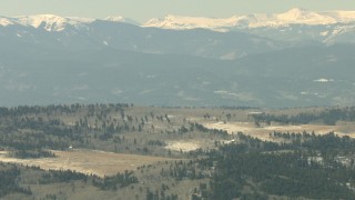 HDA13_341 - HD stock footage aerial video of hillside homes and the Rocky Mountains. Colorado