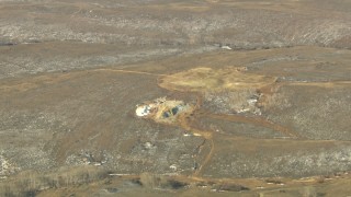 HDA13_342 - HD stock footage aerial video of approaching a small hilltop quarry in Colorado