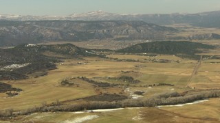 HDA13_343 - HD stock footage aerial video of approaching farms and fields in Ridgway, Colorado