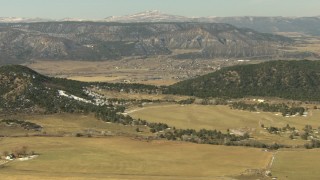 HDA13_345 - HD stock footage aerial video fly over farms toward the town of Ridgway, Colorado