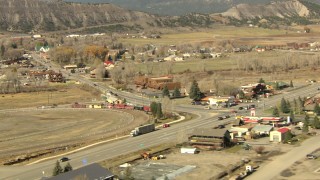 HDA13_345_02 - HD stock footage aerial video pan across a mountain ridge to reveal the small town of Ridgway, Colorado