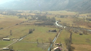 HDA13_348 - HD stock footage aerial video of flying over farms and fields near river in Ridgway, Colorado