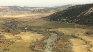 HDA13_387 - HD stock footage aerial video of farms and a river in a rural valley, Colorado