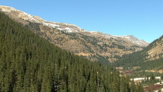HDA13_390 - HD stock footage aerial video of snow-capped mountains and evergreens in the Rocky Mountains, Colorado