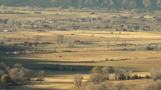 HDA13_393 - HD stock footage aerial video of grazing lands and livestock at sunset near Ridgway, Colorado