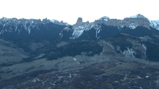 HDA13_400 - HD stock footage aerial video of the foothills and snow-capped Rocky Mountains at sunrise in Colorado