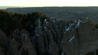 HDA13_403_04 - HD stock footage aerial video fly over a mountain ridge to reveal a valley at sunrise in the Rocky Mountains, Colorado