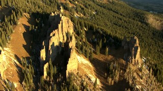 HDA13_403_05 - HD stock footage aerial video of rock formations on a mountain slope at sunrise in the Rocky Mountains, Colorado