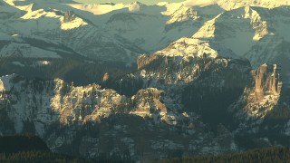 HDA13_409_01 - HD stock footage aerial video of steep and snowy mountains at sunrise, Rocky Mountains, Colorado