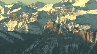 HDA13_410 - HD stock footage aerial video of jagged peaks with snow at sunrise in the Rocky Mountains, Colorado