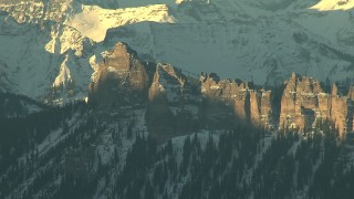 HDA13_410_01 - HD stock footage aerial video of rugged mountains with steep slopes and snow at sunrise, Rocky Mountains, Colorado
