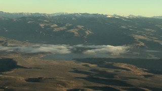 HDA13_412 - HD stock footage aerial video of the Blue Mesa Reservoir and Rocky Mountains at sunrise, Colorado