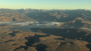 HDA13_414_01 - HD stock footage aerial video of a wide view of the Blue Mesa Reservoir and Rocky Mountains at sunrise, Colorado